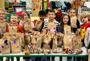 Y Kindergarteners proudly show off their 'Boo Bags'