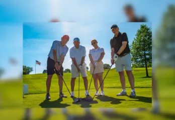 Golf Foursome posed on the green.