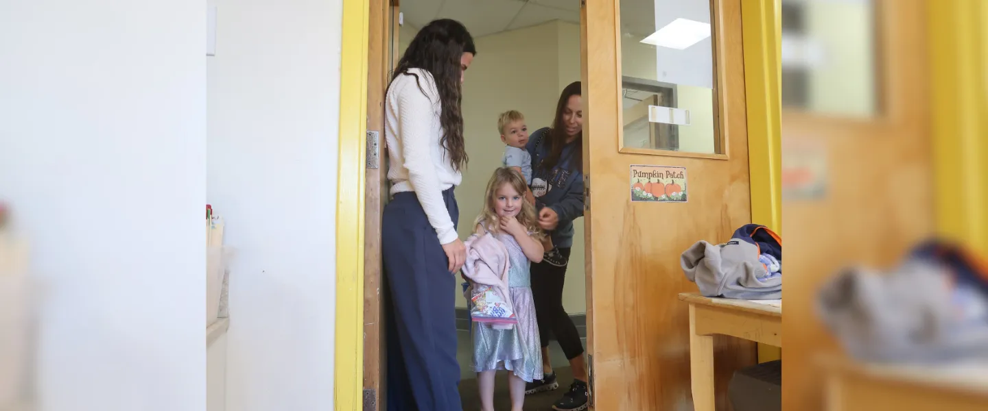 Brother and sister being dropped off by their mom at Kids Club.