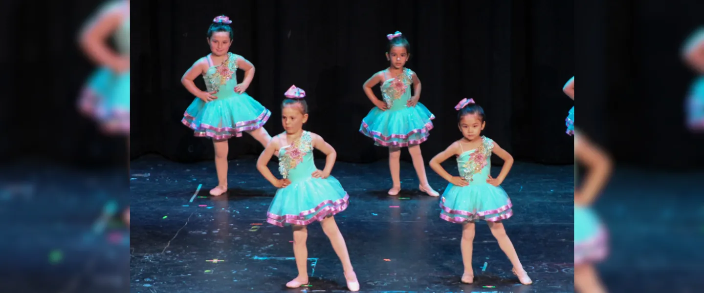 four dancers on stage