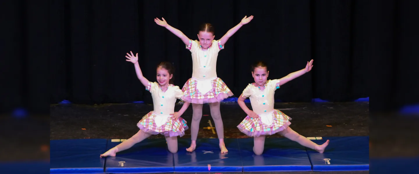 three dancers on stage