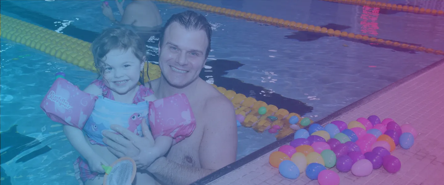 Father and child at annual Easter Egg Hunt in the Pool