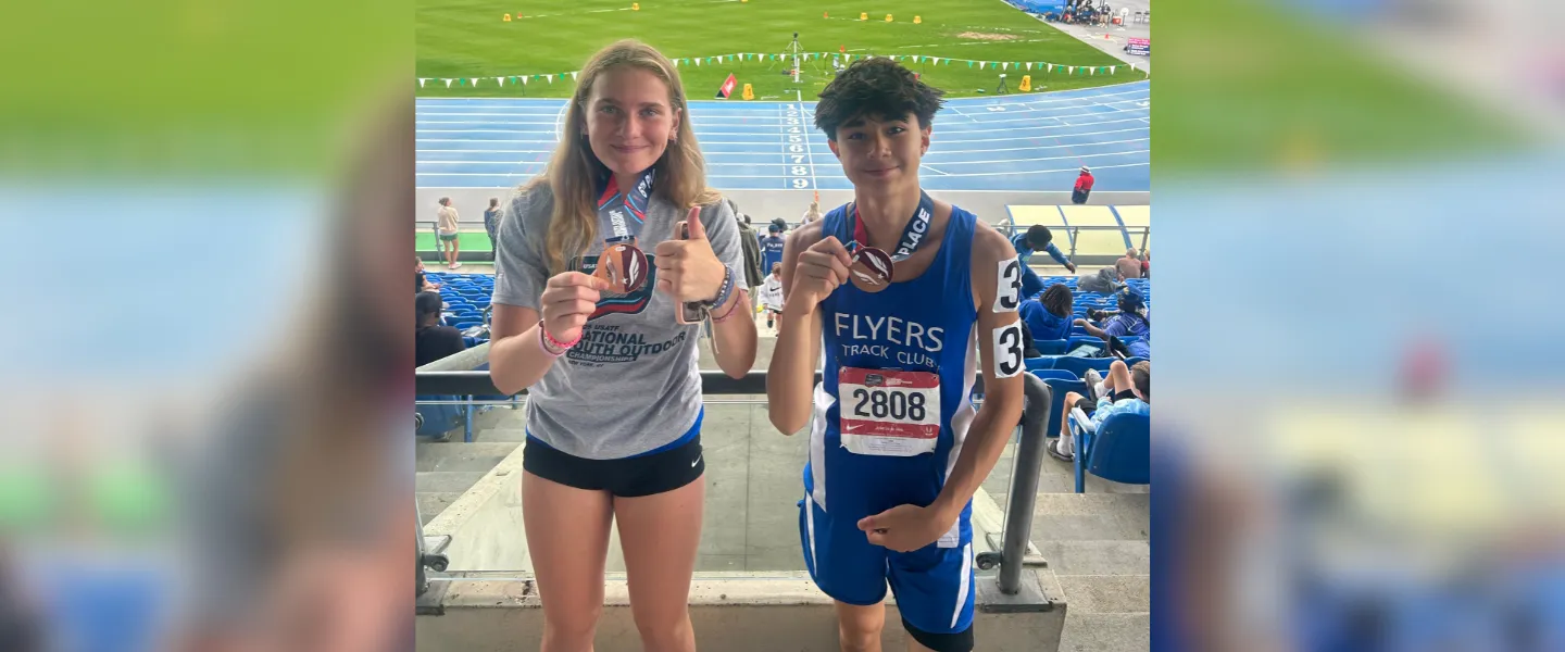 Two Flyers athletes with their medals