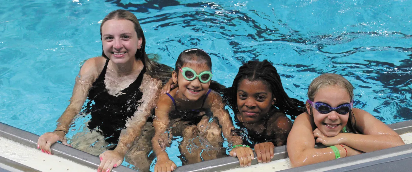 3 pioneer campers with their counselor