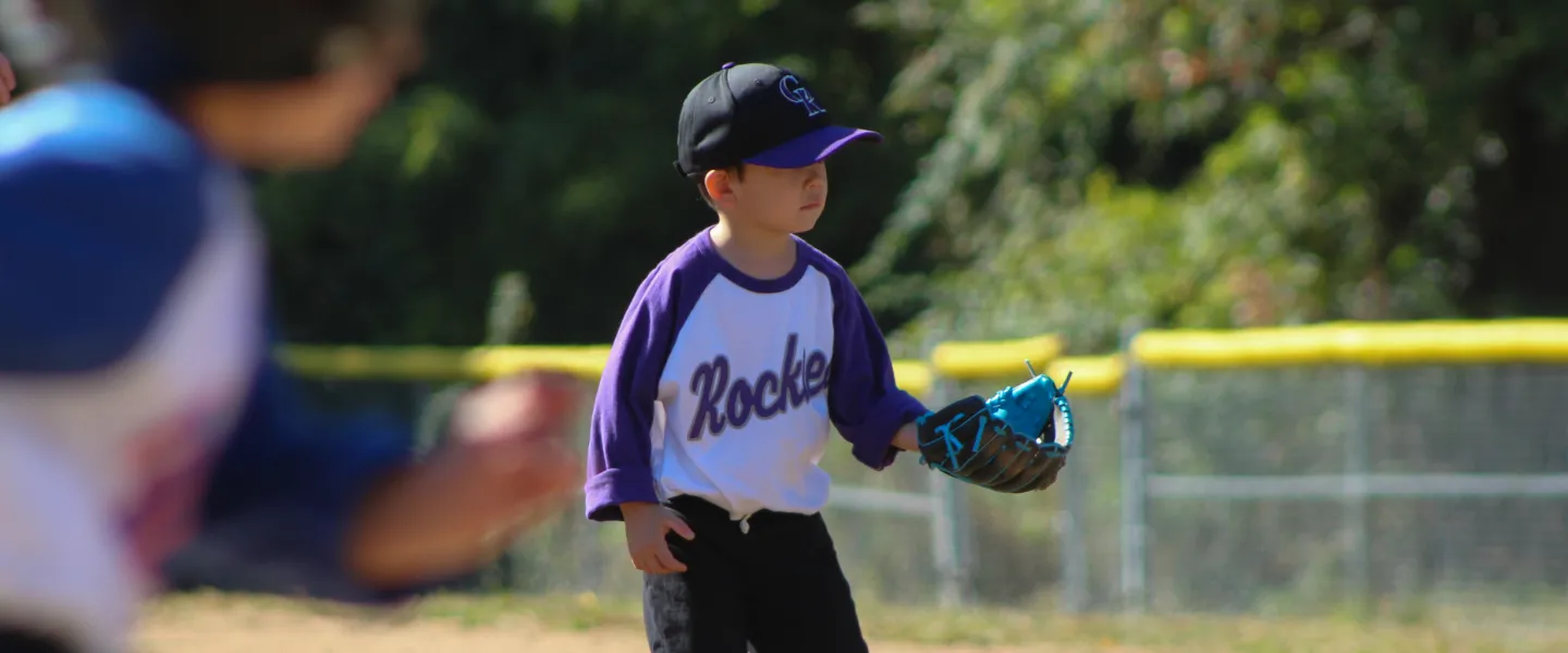 Rockies T-ball athlete  ready to catch a baseball 