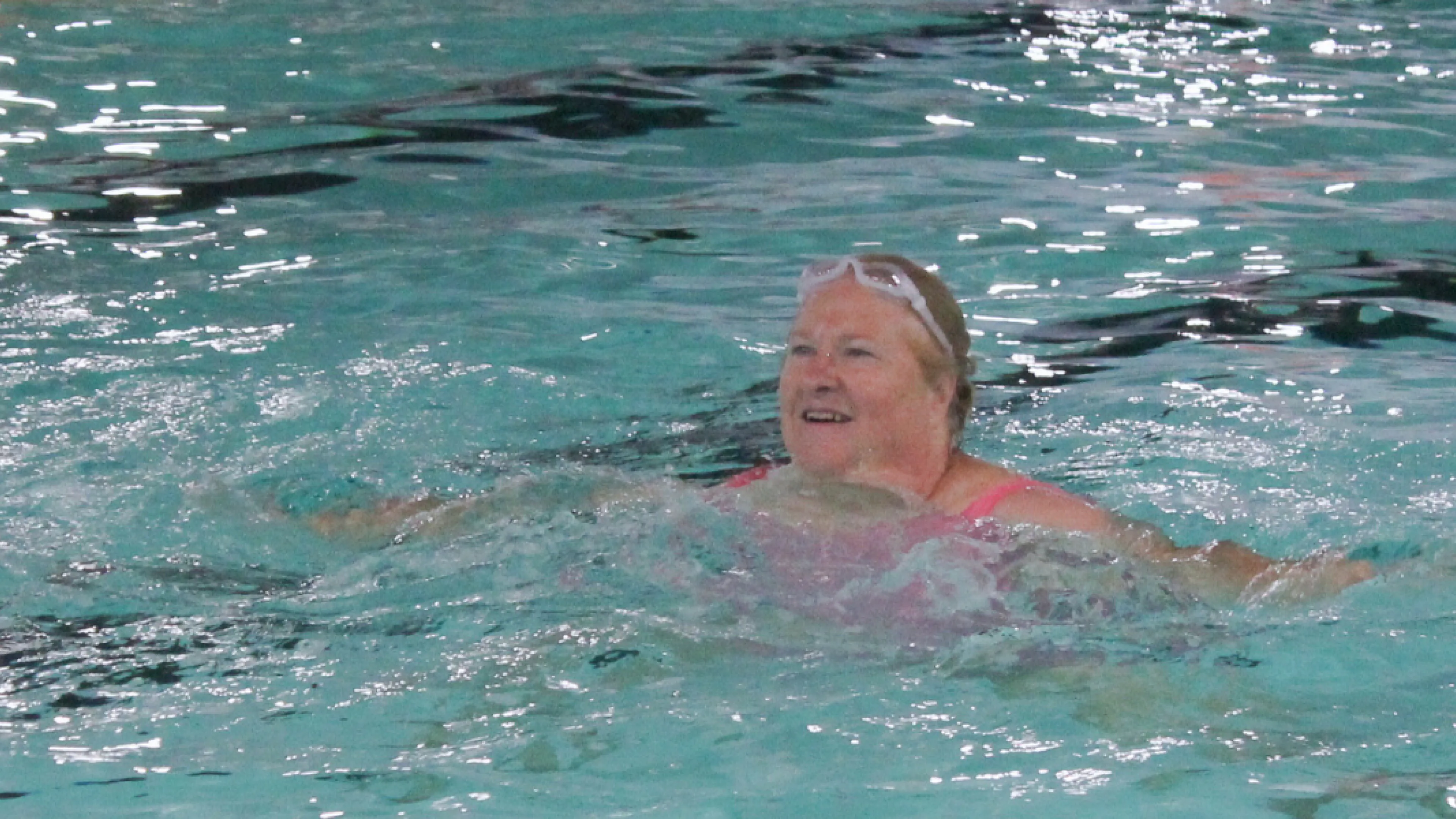 Woman participating in an water fitness class