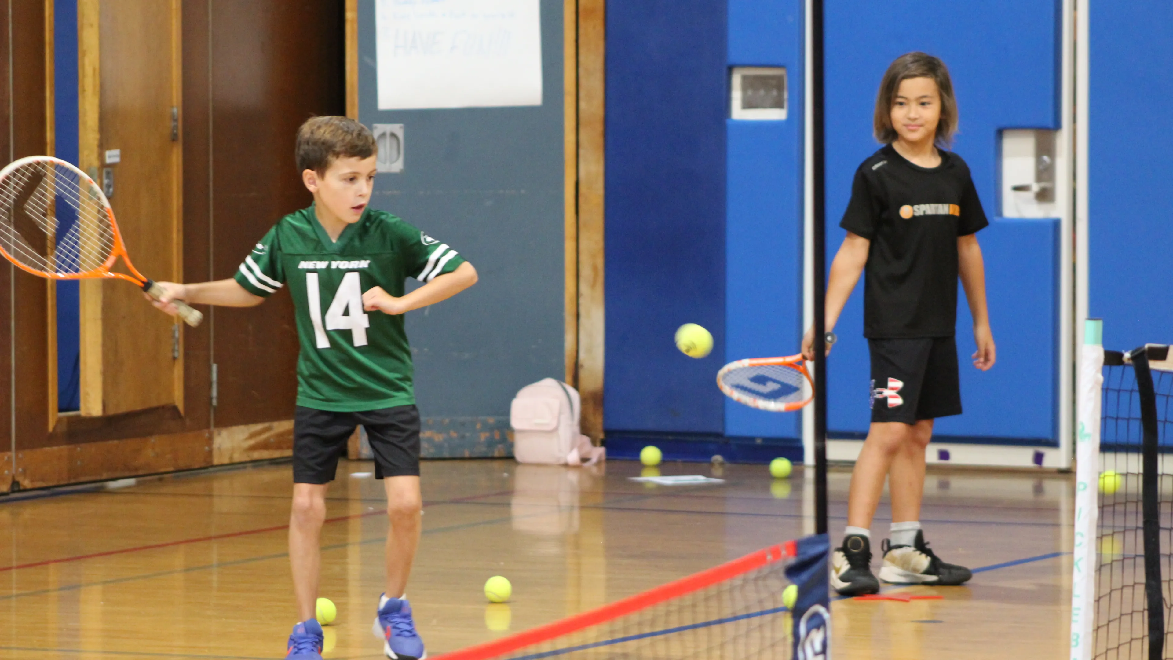 Sports Campers Playing Tennis