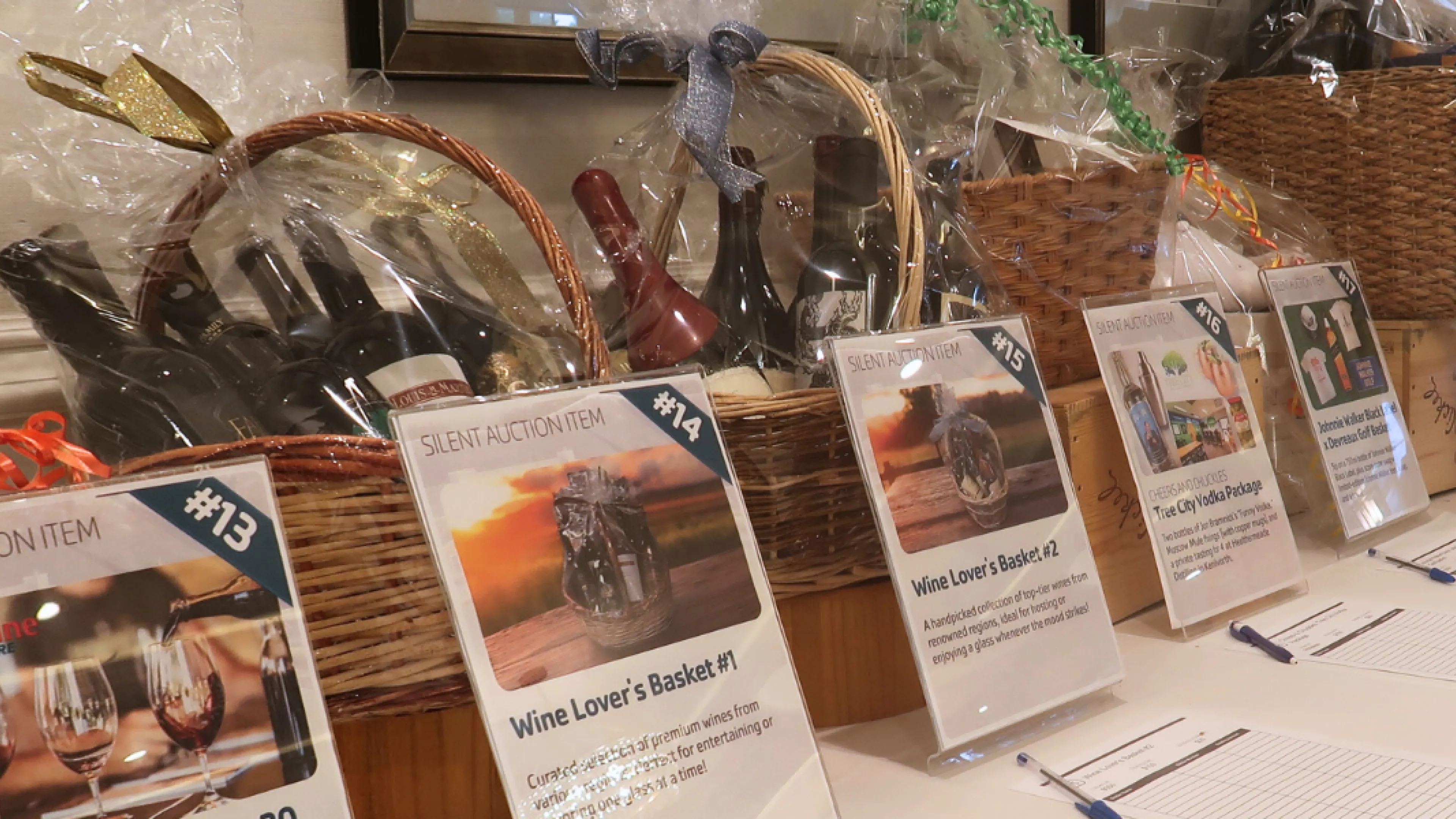 Table of silent auction items at golf classic