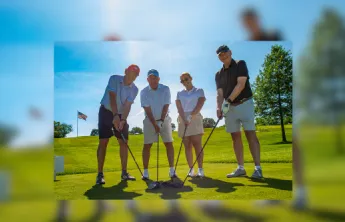 Golf Foursome posed on the green.