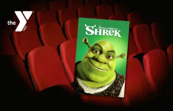 Movie theater seats with a Y logo and Shrek movie cover